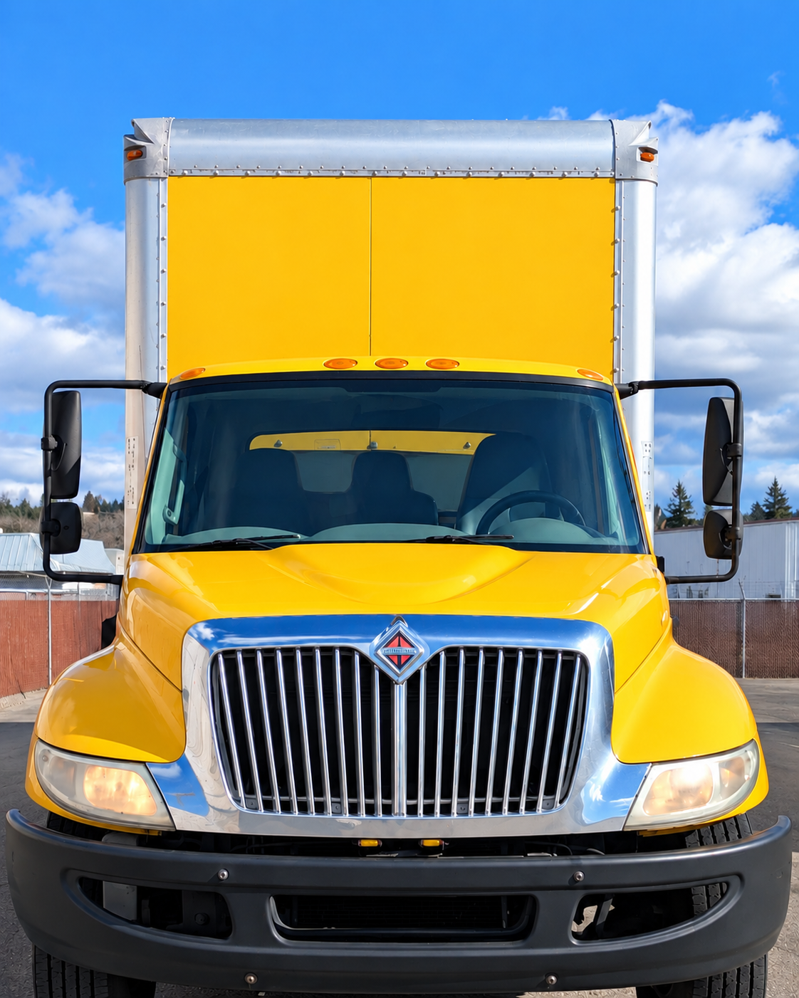 Clean yellow Warp Star Logistics box truck